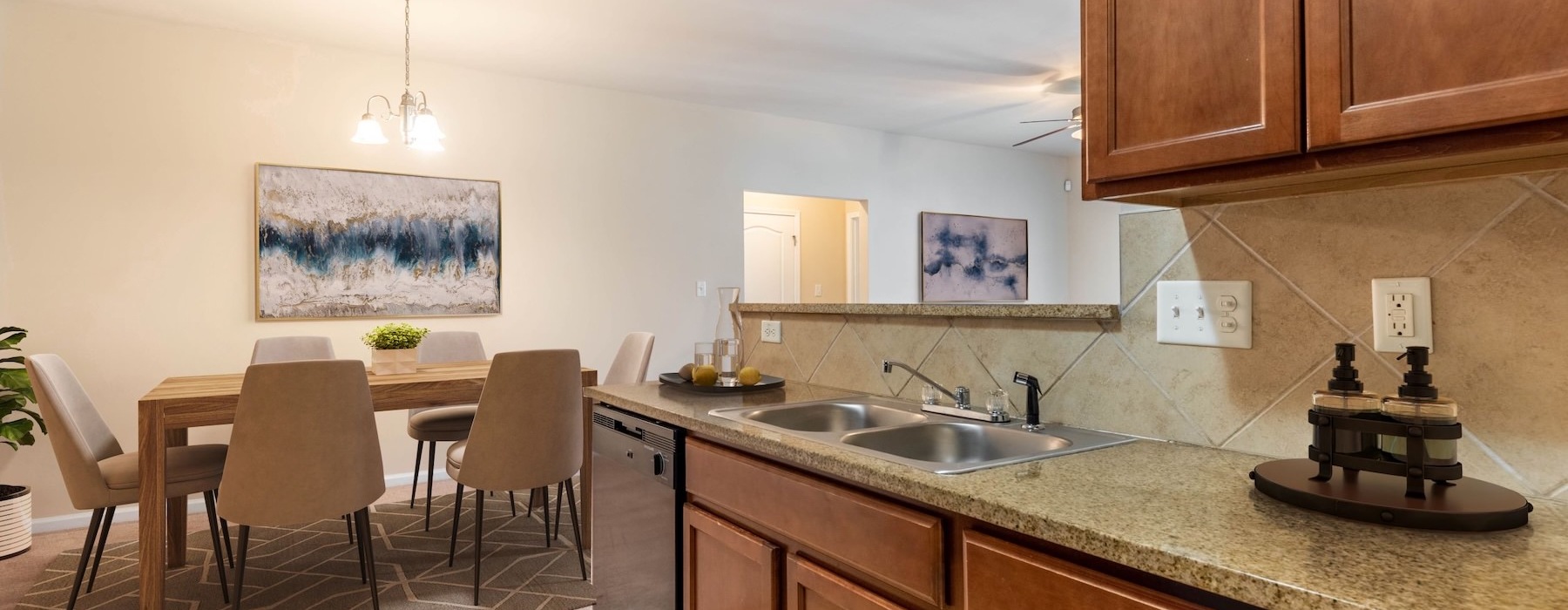 a kitchen with a table and chairs