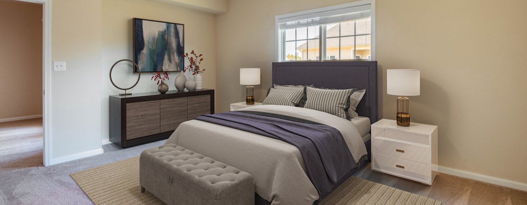 a bedroom with a bed and two nightstands