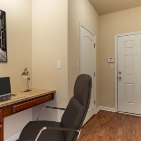 a desk with a laptop on it