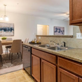 a kitchen with a table and chairs