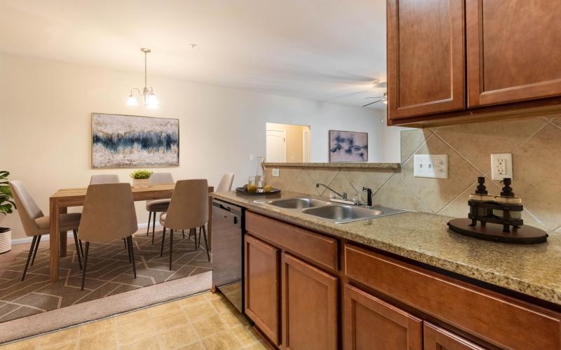 a kitchen with a table and chairs