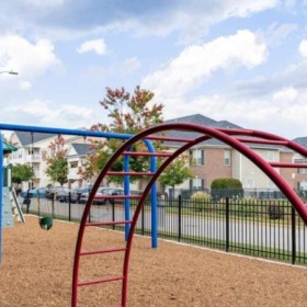 a playground with a fence