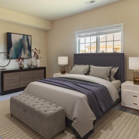 a bedroom with a bed and a couch